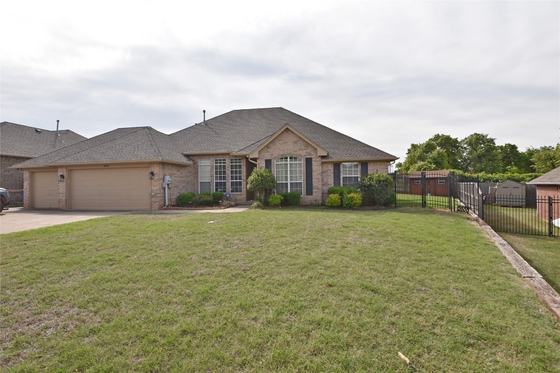 4200 Ainsley Court, Edmond, OK 73034 ranch-style home featuring a garage and a front yard