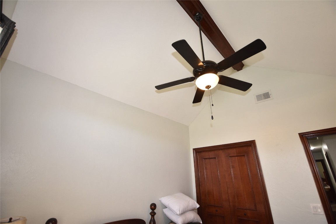 4200 Ainsley Court, Edmond, OK 73034 room details with ceiling fan and beam ceiling