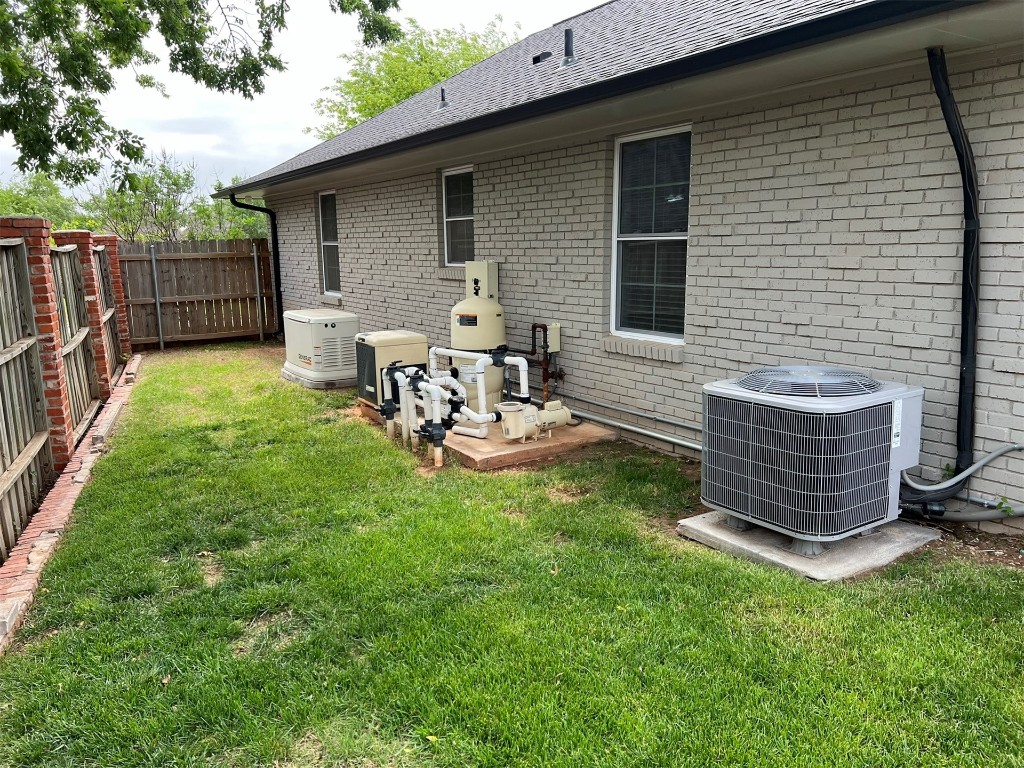 2611 Cambridge Court, Oklahoma City, OK 73116 view of yard with central air condition unit