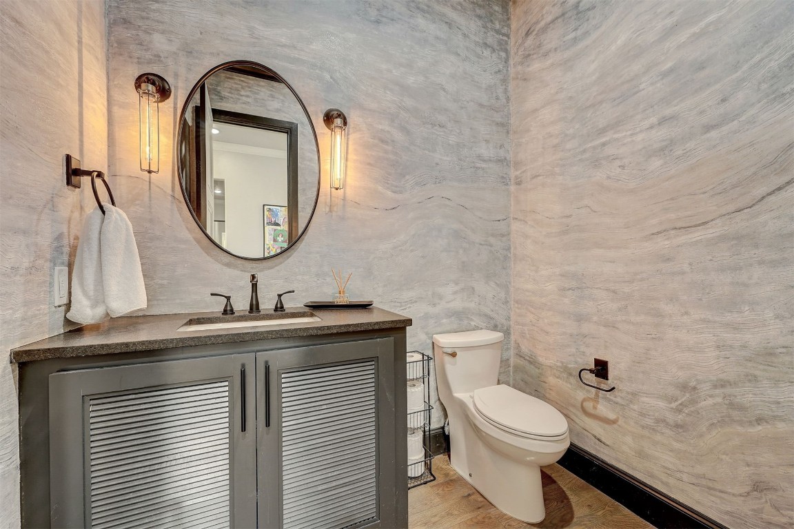 3217 Novara Drive, Arcadia, OK 73007 bathroom featuring vanity, hardwood / wood-style flooring, and toilet
