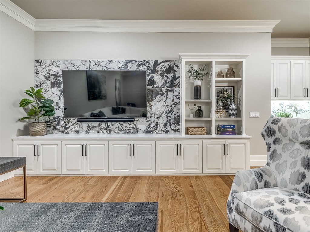 4324 Corridor Drive, Edmond, OK 73034 living room featuring light wood-type flooring and ornamental molding