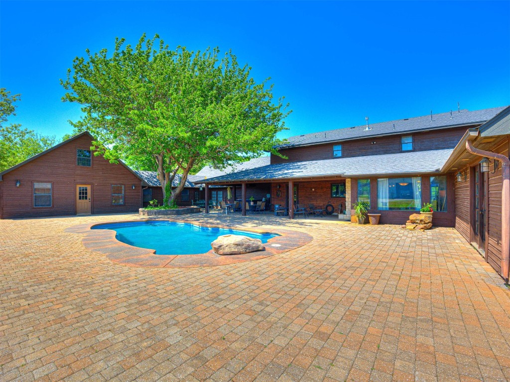 1580 NW 220th Street, Edmond, OK 73025 view of swimming pool featuring a patio
