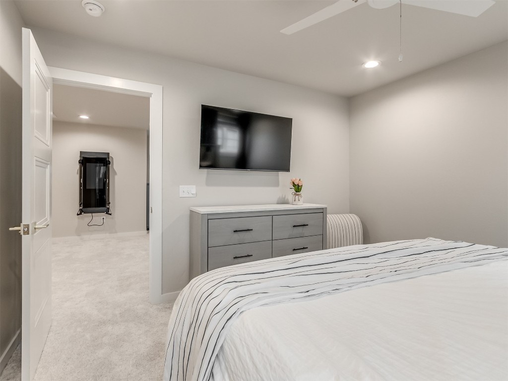 59 Redbud Street, Carlton Landing, OK 74432 bedroom with light carpet and ceiling fan