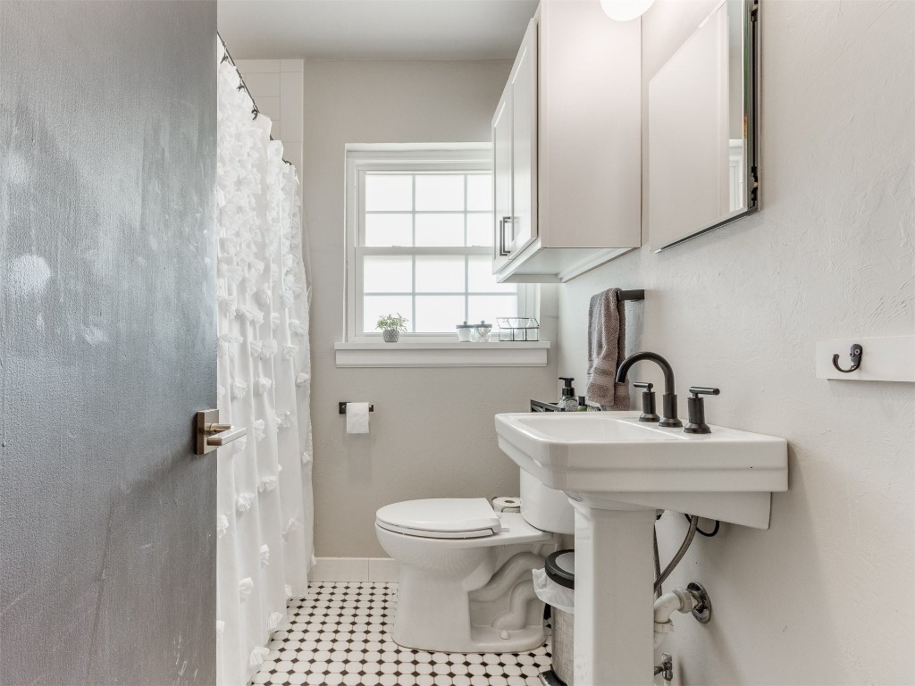 9537 Greystone Avenue, Oklahoma City, OK 73120 bathroom featuring tile floors and toilet