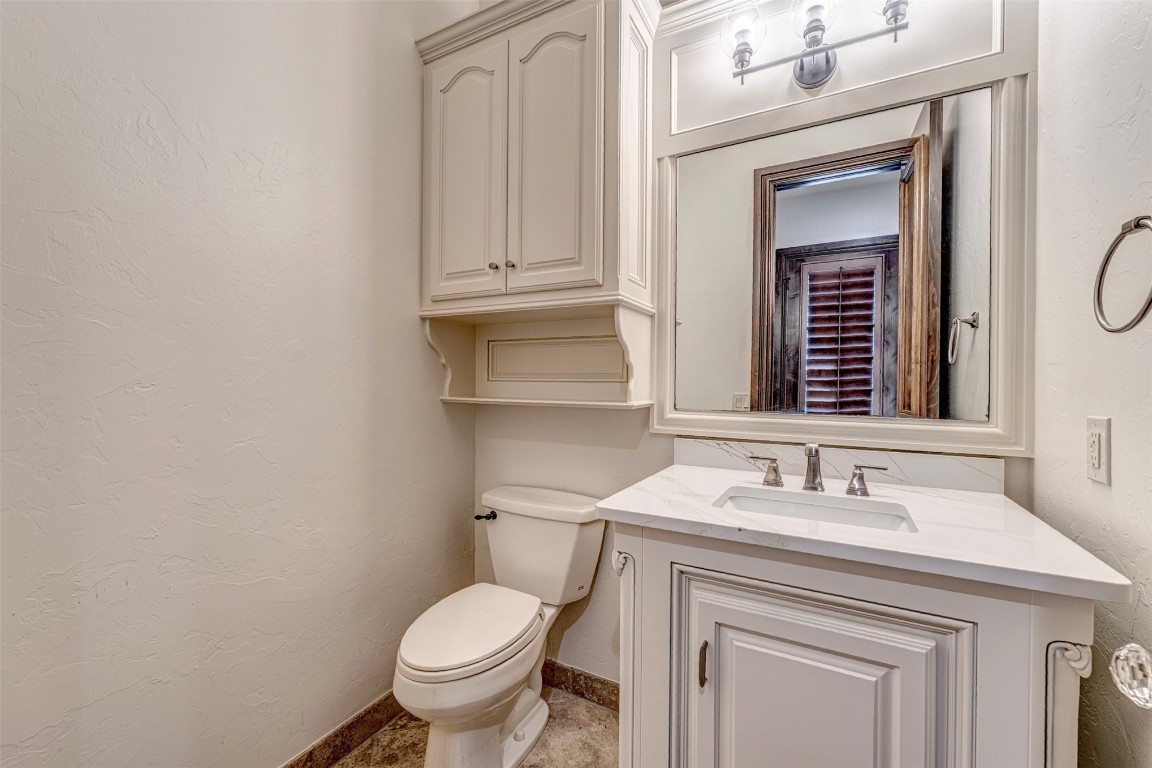 6516 NW Grand Boulevard, Nichols Hills, OK 73116 bathroom featuring tile flooring, vanity, and toilet