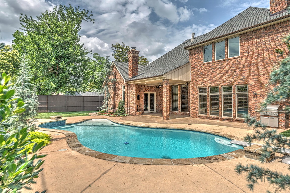 6516 NW Grand Boulevard, Nichols Hills, OK 73116 view of pool featuring a patio, ceiling fan, and a grill