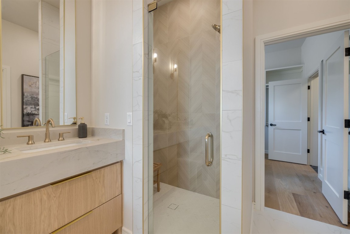 303 E 4th Street, Edmond, OK 73034 bathroom featuring double vanity