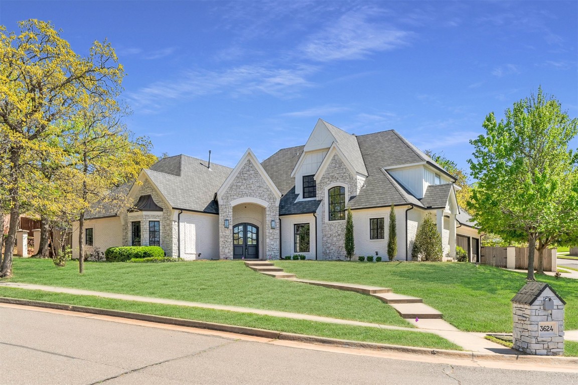 3624 Hunters Creek Road, Edmond, OK 73003 french country inspired facade with a front lawn