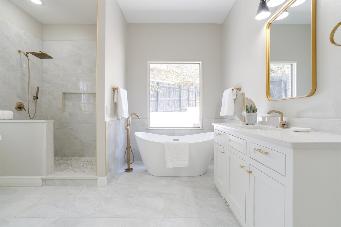 3624 Hunters Creek Road, Edmond, OK 73003 bathroom with tile flooring, vanity, and shower with separate bathtub