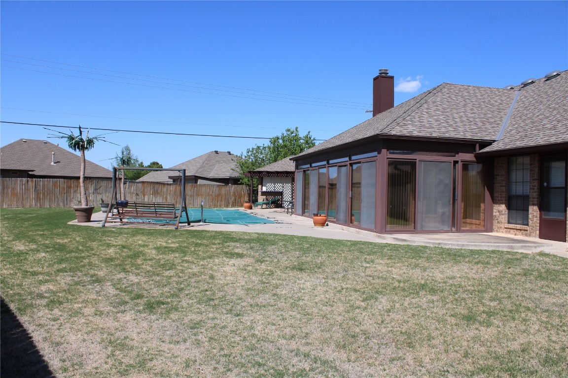 7013 Charlene Drive, Oklahoma City, OK 73132 view of yard featuring a patio