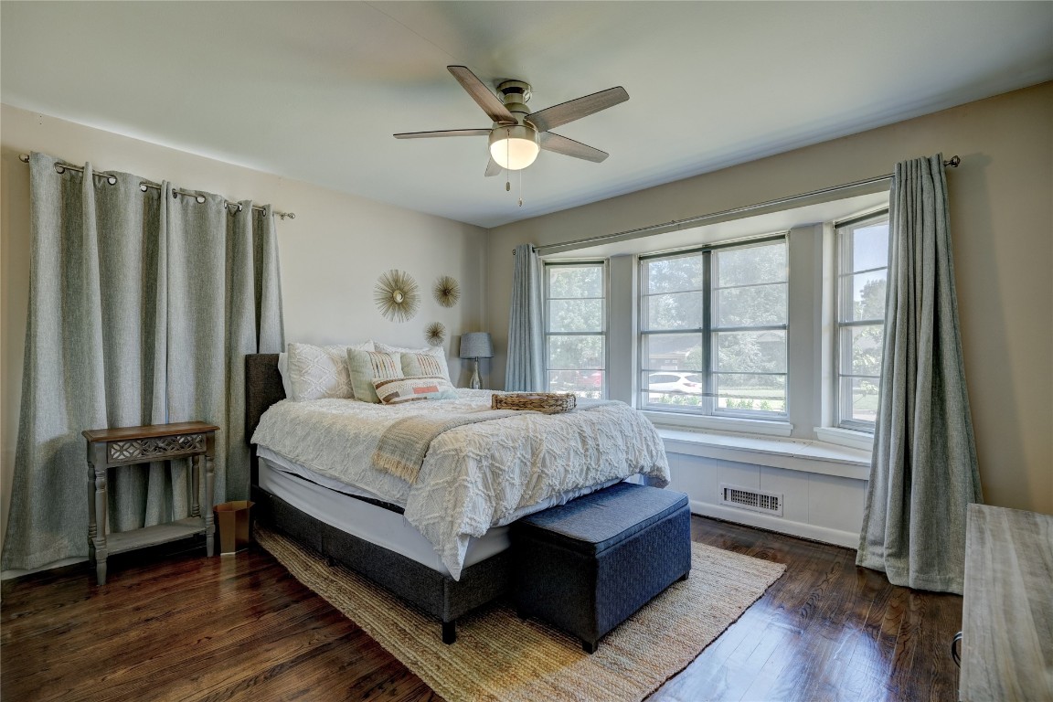 2309 Huntleigh Drive, Oklahoma City, OK 73120 bedroom featuring dark wood-type flooring and ceiling fan