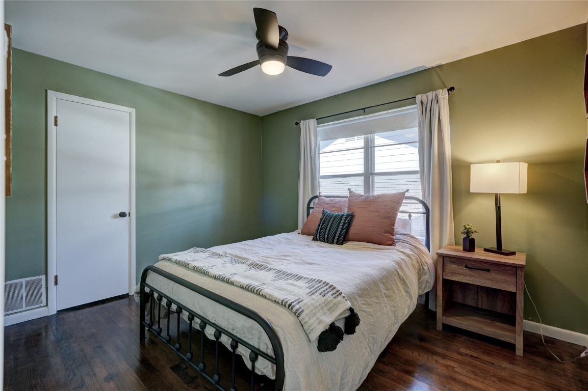 2309 Huntleigh Drive, Oklahoma City, OK 73120 bedroom with dark hardwood / wood-style floors and ceiling fan