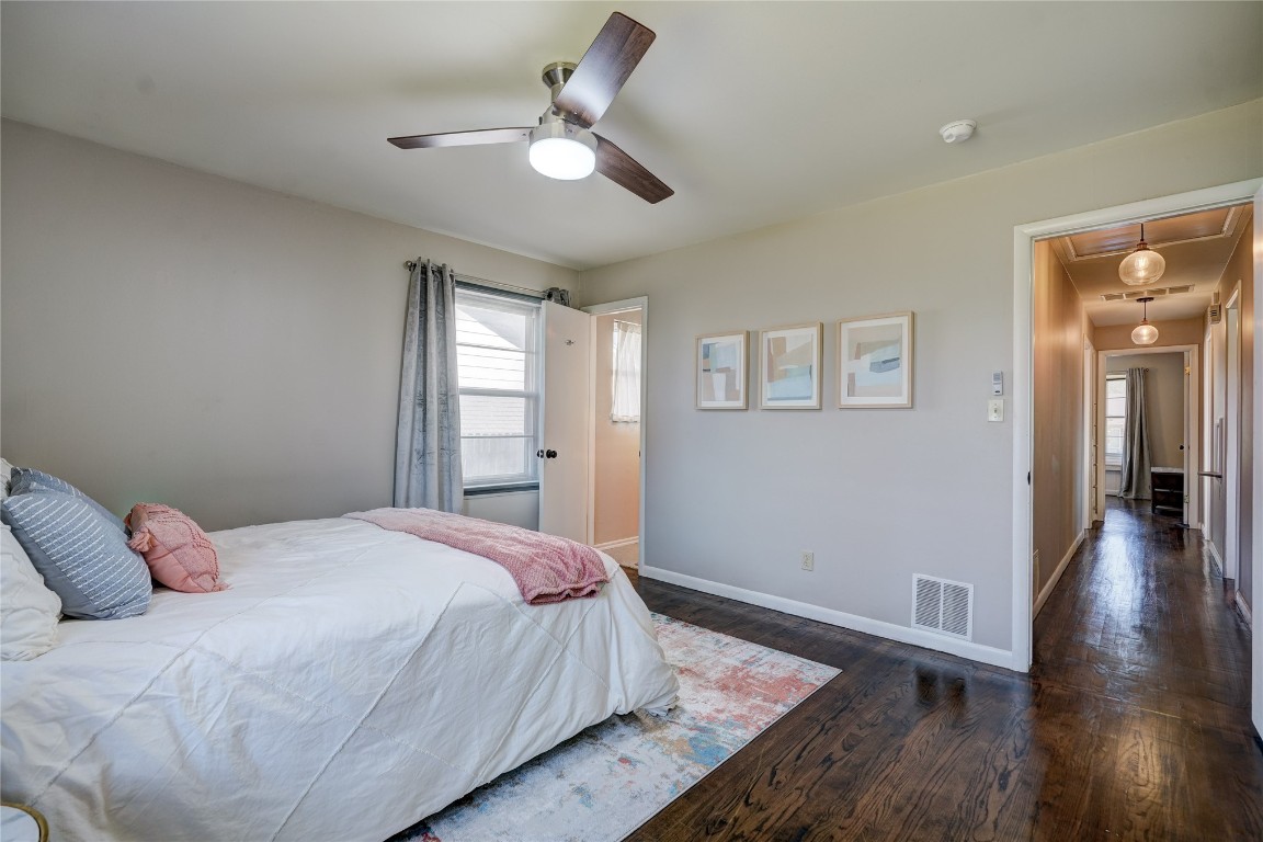 2309 Huntleigh Drive, Oklahoma City, OK 73120 bedroom with dark hardwood / wood-style flooring and ceiling fan
