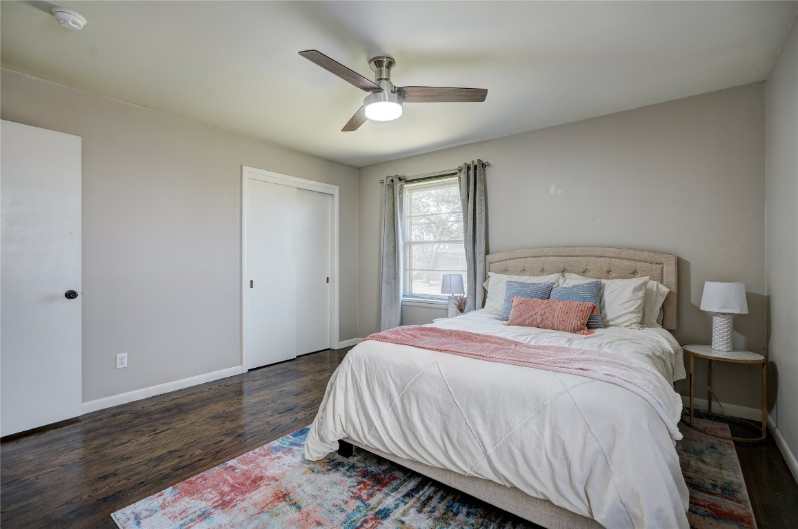 2309 Huntleigh Drive, Oklahoma City, OK 73120 bedroom with ceiling fan and dark hardwood / wood-style flooring