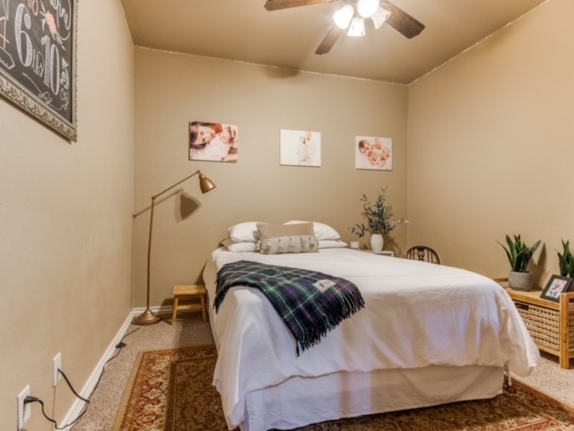 18309 Haslemere Lane, Edmond, OK 73012 carpeted bedroom featuring ceiling fan