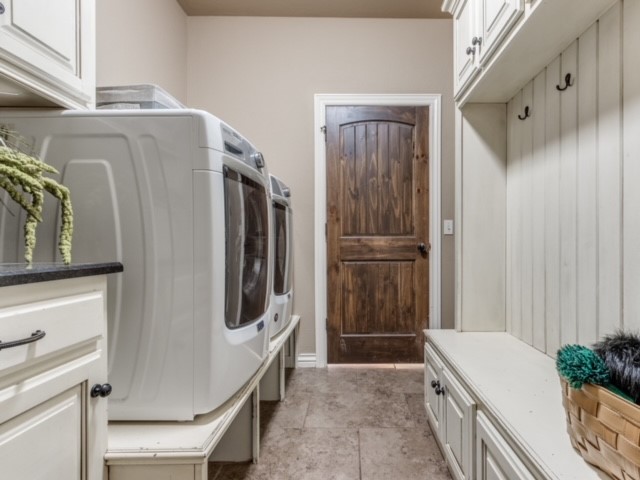 18309 Haslemere Lane, Edmond, OK 73012 mudroom featuring light tile floors and washer and clothes dryer