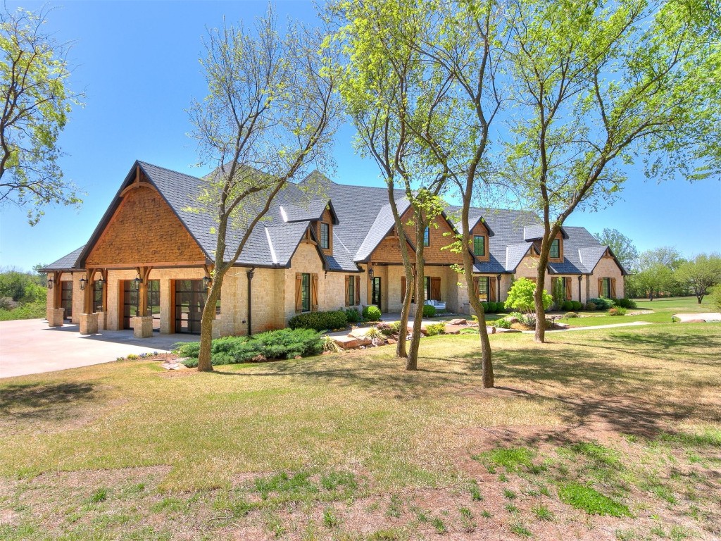 2892 Rustic View Drive, Goldsby, OK 73093 tudor-style house featuring a front lawn
