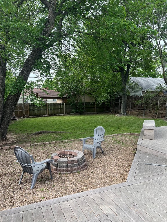 3112 NW Drexel Court, Oklahoma City, OK 73107 view of yard with a fire pit