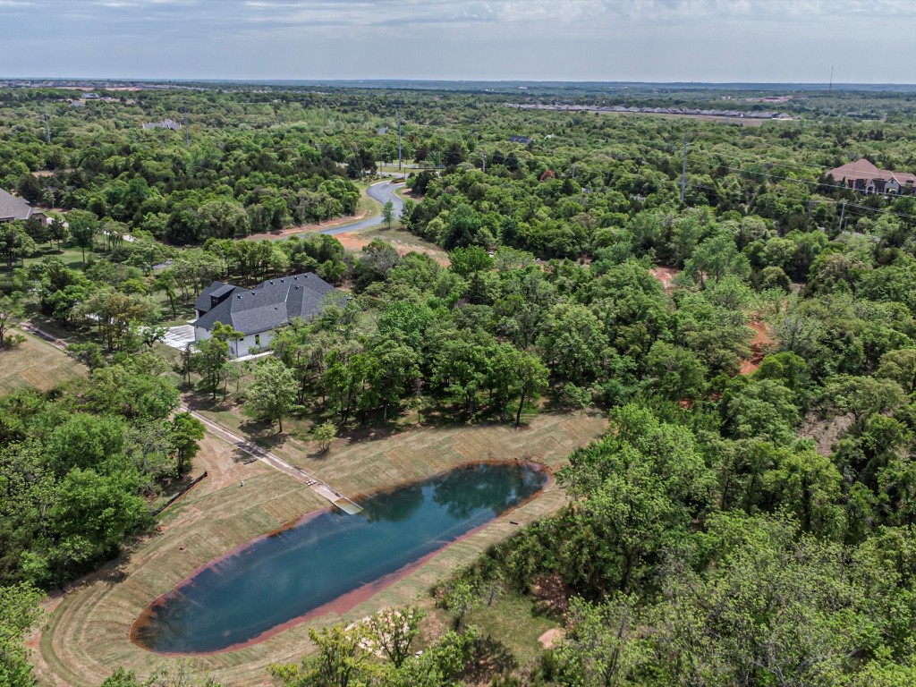 4217 Grand Timber Drive, Edmond, OK 73034 aerial view featuring a water view