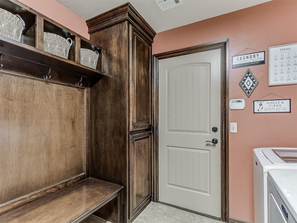 705 Evening Drive, Yukon, OK 73099 mudroom featuring independent washer and dryer and light tile floors
