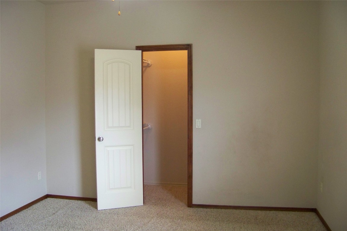 8317 NW 62nd Street, Oklahoma City, OK 73132 empty room with carpet flooring