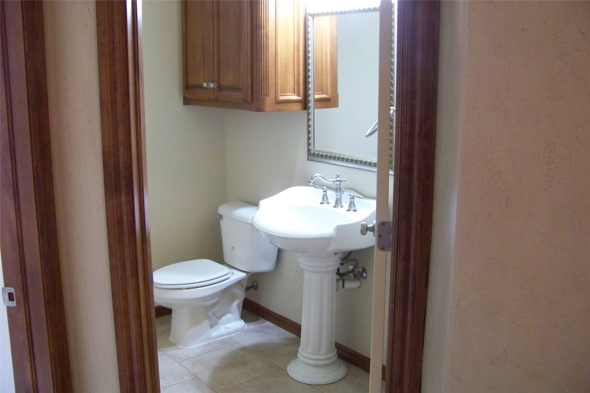 8317 NW 62nd Street, Oklahoma City, OK 73132 bathroom featuring tile flooring and toilet