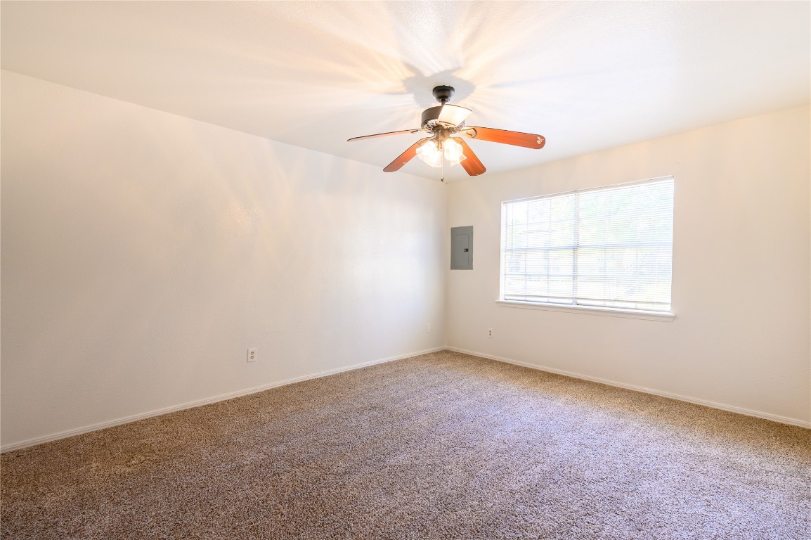 1719 E Lindsey Street, #1, Norman, OK 73071 carpeted spare room featuring ceiling fan