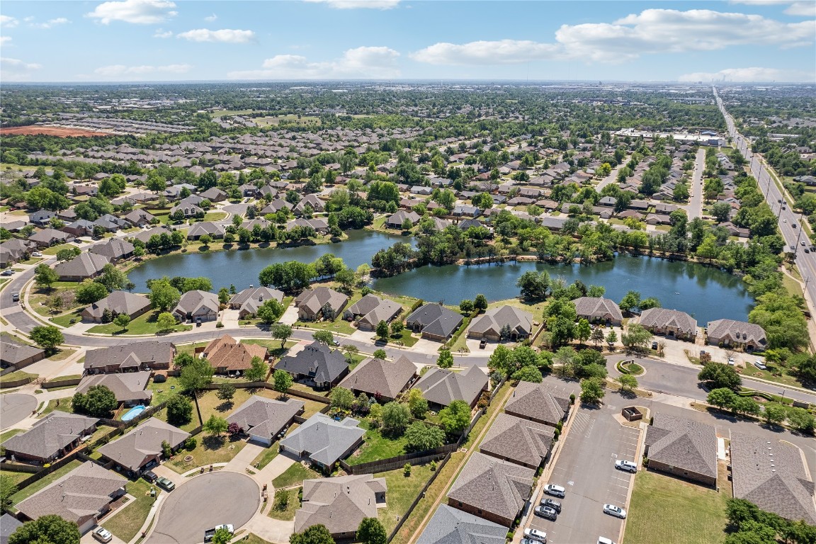 2147 Bridgeview Boulevard, Edmond, OK 73003 aerial view with a water view