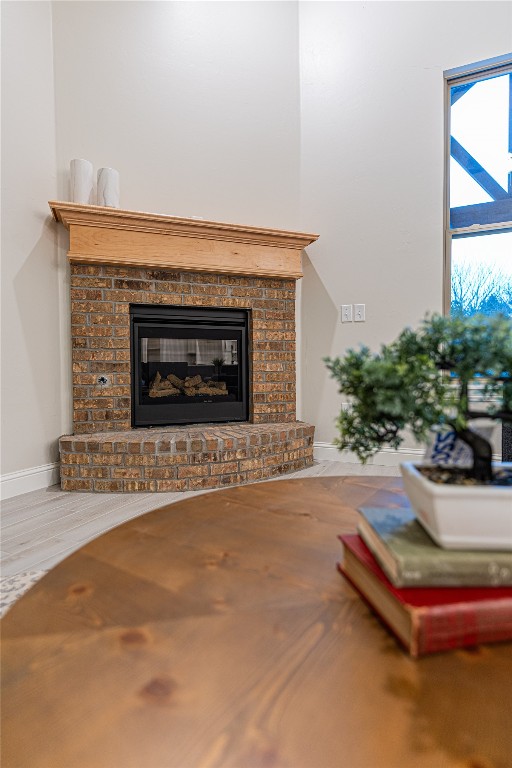 9016 NE 141st Street, Jones, OK 73049 living room with a fireplace and hardwood / wood-style flooring