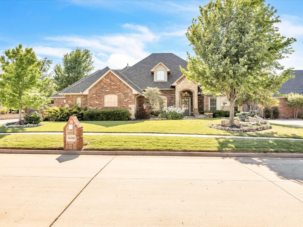 Experience the elegance and privacy of the gated Oakmond neighborhood in Edmond, Oklahoma, with this stunning residence nestled on a quiet cul-de-sac street. This home features four bedrooms, a study, three and a half baths, two living spaces, and two dining areas. The entry welcomes guest with tall ceilings and a beautiful first glimpse of the backyard. To the left, through the kitchen, the heart of this home flows with open design to the breakfast room & living room with fireplace. The entire space is sunlit with statement floor-to-ceiling windows holding the picturesque and private backyard center stage. The kitchen has granite countertops, stained wood cabinetry, & stainless steel appliances, including double ovens & a built-in ice maker. An under-counter microwave and a flat-top electric range add to the functionality, while the expansive countertop provides ample bar seating if desired. To the right of the entryway, the main bedroom is everything you would expect in a home of this caliber - grand with no shortage of space. The en suite exceeds expectations with a sauna, a fully updated shower, a double-sink vanity with abundant storage, and a expansive walk-in closet. The study, with its large bay windows and built-in cabinetry, captures the morning sun beautifully. With the split floor plan, the master suite and study is on one side, while three additional bedrooms and two bathrooms (including a Jack and Jill bath and one en suite) are located on the opposite side. Outdoors, the property is an escape with mature flower beds, trees, & large landscaping rocks that double as seating under cafe lights, creating a perfect ambiance for relaxation or entertaining. Notable features: storm shelter in garage, powder bath for guests, a laundry room with granite counters, sink, and extensive cabinetry, a decked attic space, a retractable screen on the back door, a 2022 water heater, hardwood floors in the study, & wood-look tile flooring everywhere else.