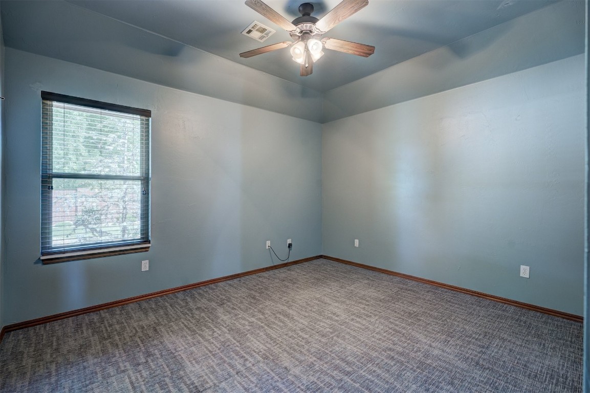2809 SW 135th Street, Oklahoma City, OK 73170 unfurnished room featuring carpet flooring and ceiling fan