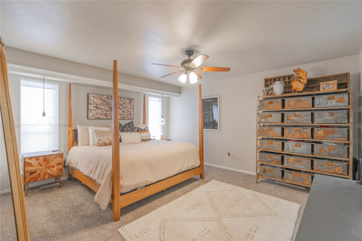 5217 NW 109th Street, Oklahoma City, OK 73162 carpeted bedroom featuring multiple windows and ceiling fan