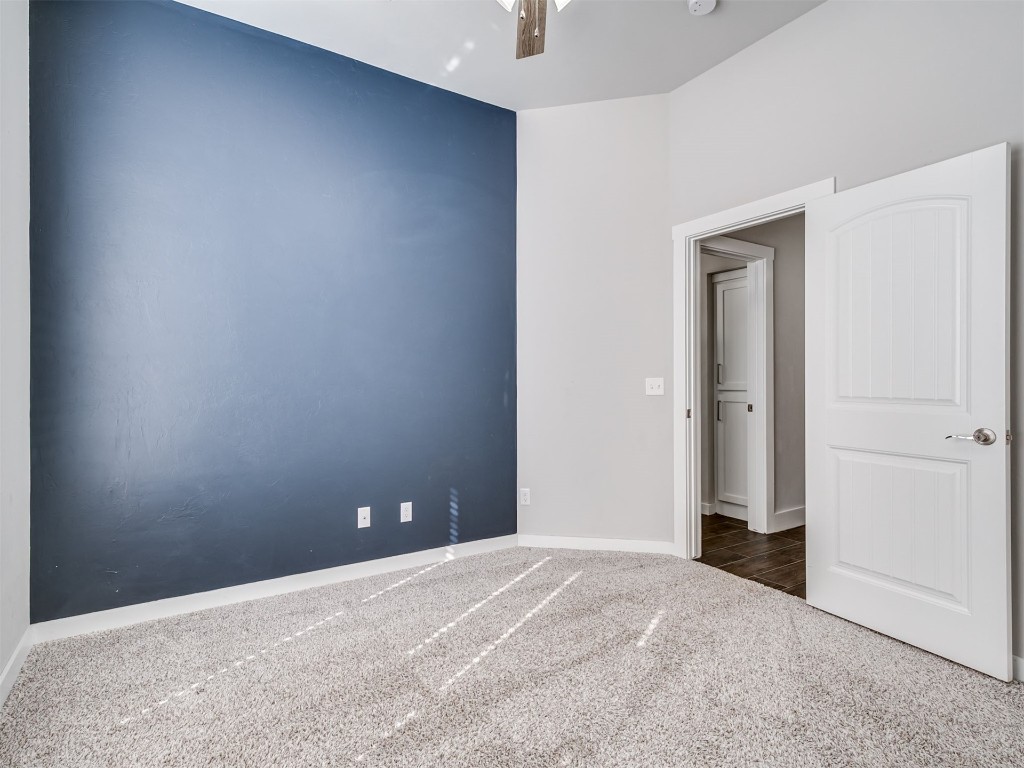 515 Isabella Drive, Blanchard, OK 73010 unfurnished room with dark carpet