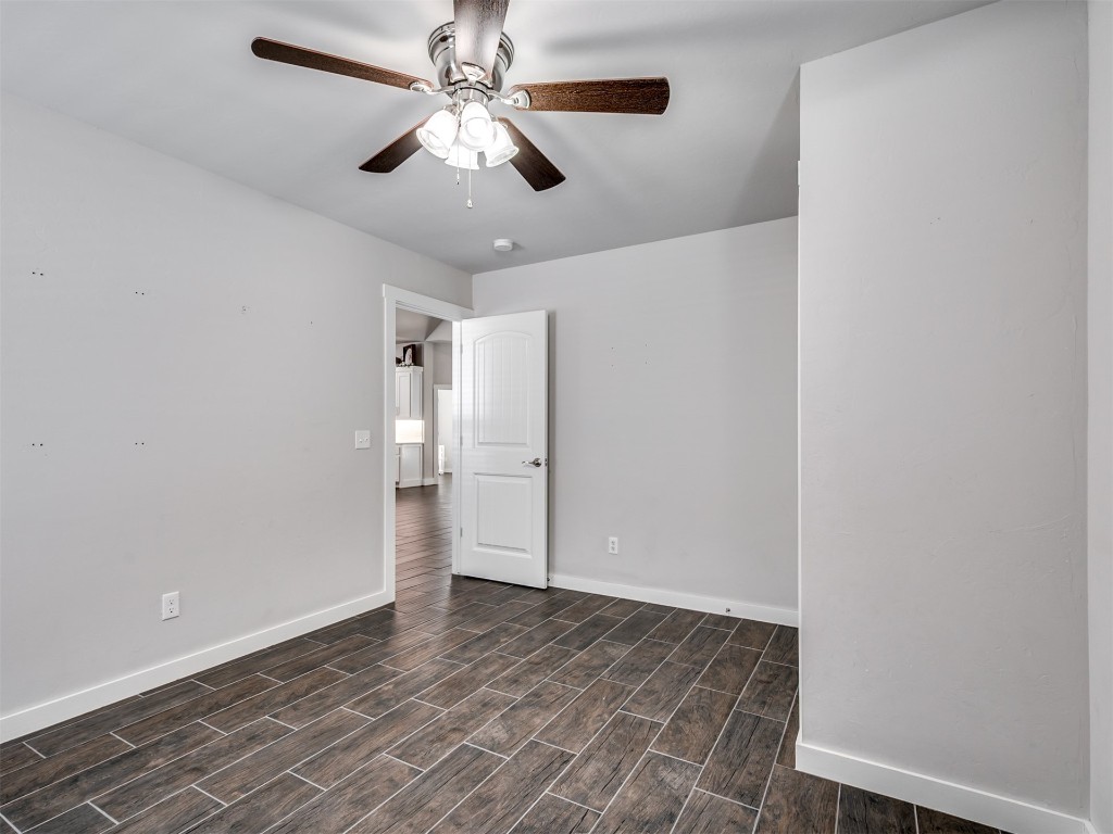 515 Isabella Drive, Blanchard, OK 73010 unfurnished room with ceiling fan and dark hardwood / wood-style flooring