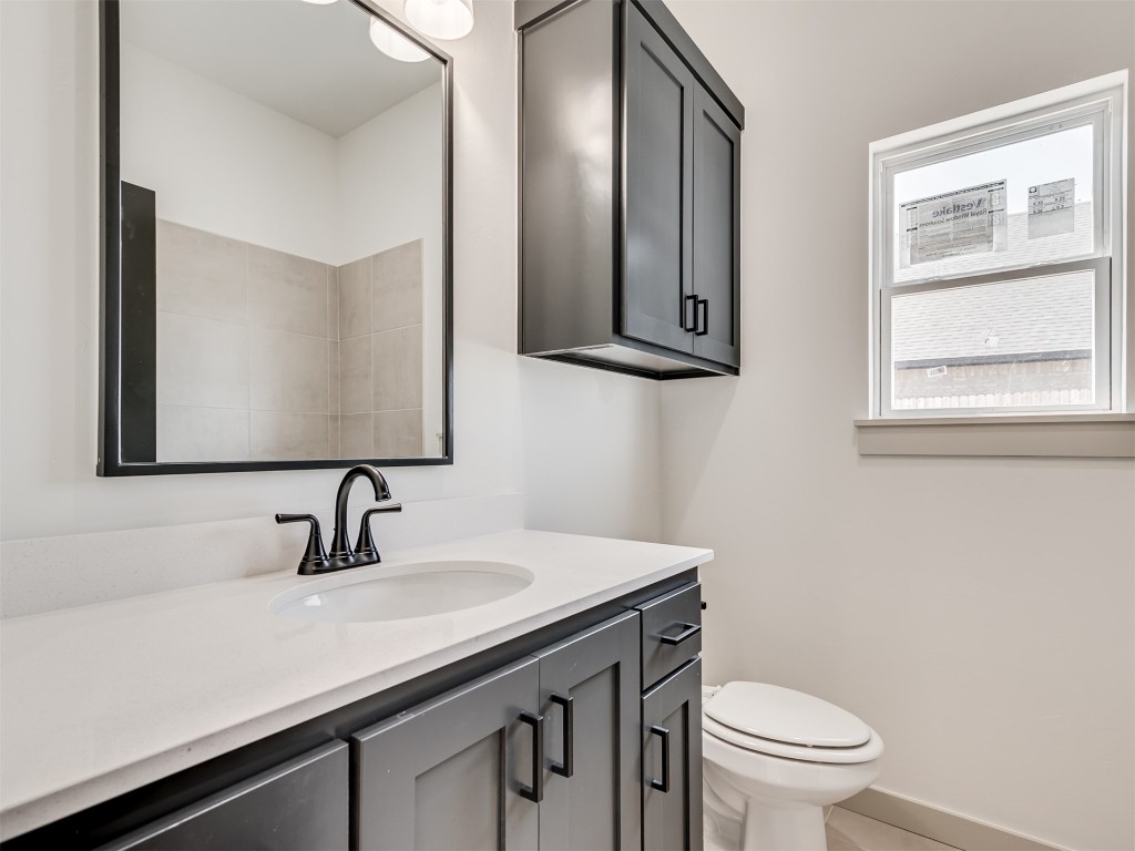 118 NE Primrose Point Avenue, Piedmont, OK 73128 bathroom featuring vanity and toilet