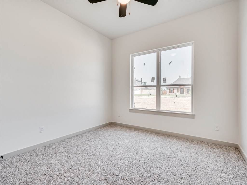 118 NE Primrose Point Avenue, Piedmont, OK 73128 carpeted empty room with ceiling fan