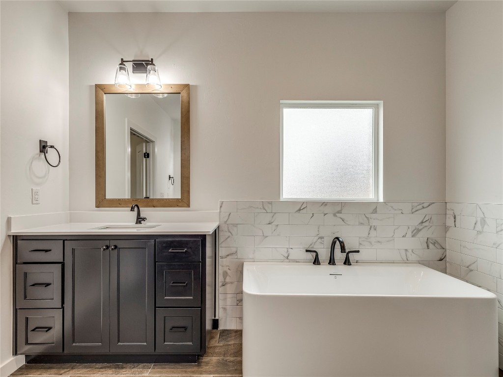 143 Primrose Point Avenue, Piedmont, OK 73078 bathroom with a washtub, tile flooring, and vanity