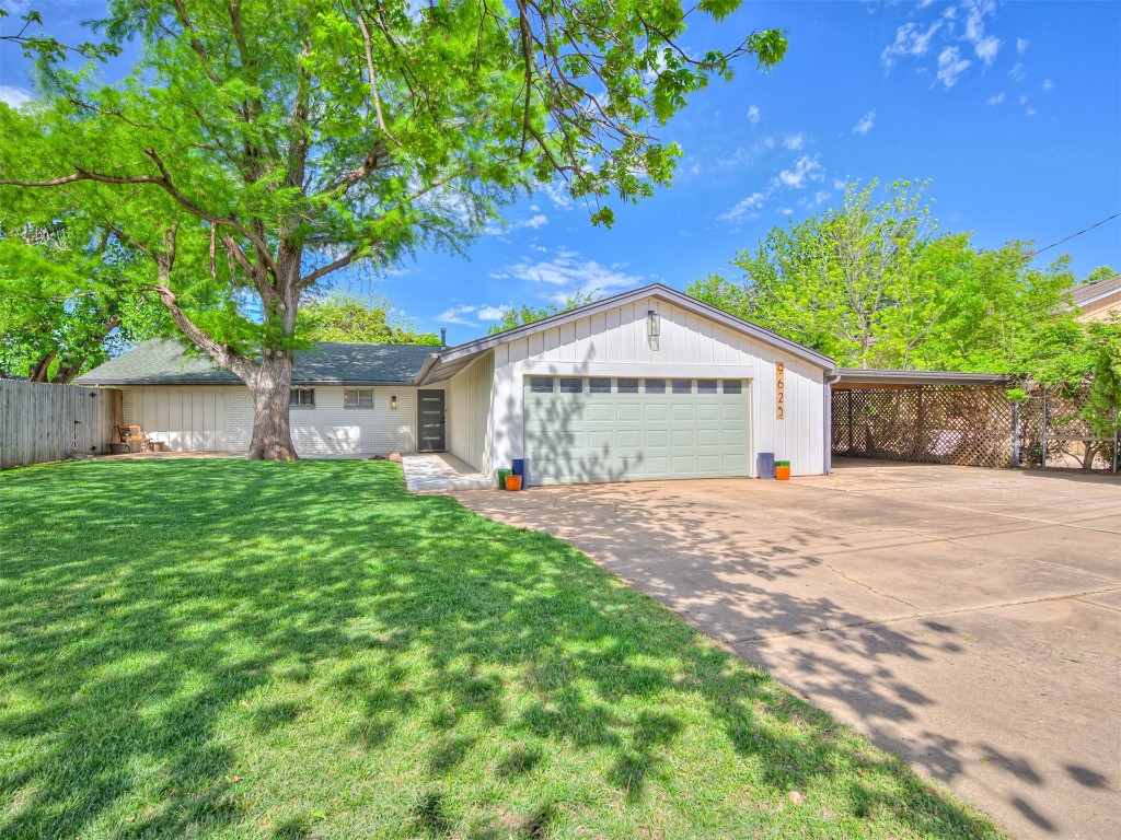 9625 Ritter Road, Oklahoma City, OK 73162 ranch-style home featuring a garage and a front yard