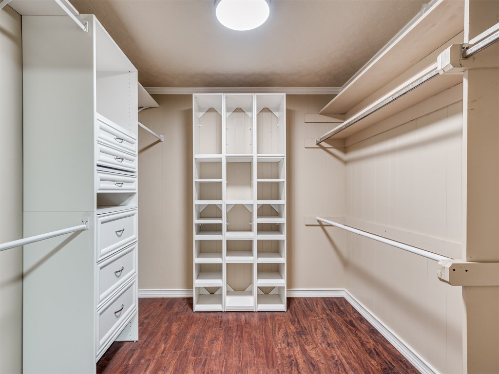 9625 Ritter Road, Oklahoma City, OK 73162 spacious closet featuring dark hardwood / wood-style floors