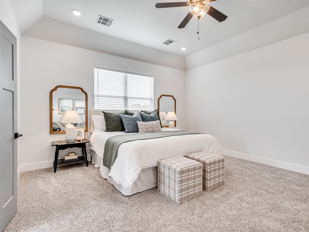 446 Venetian Avenue, Piedmont, OK 73078 carpeted bedroom featuring ceiling fan and vaulted ceiling