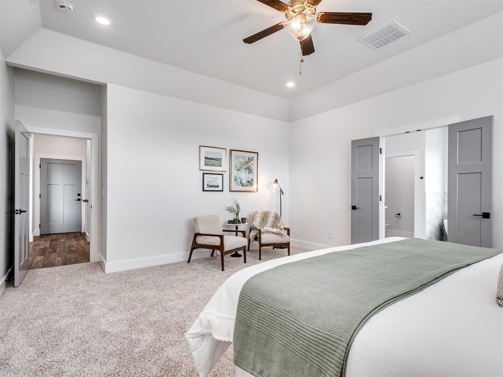 446 Venetian Avenue, Piedmont, OK 73078 bedroom with dark colored carpet and ceiling fan