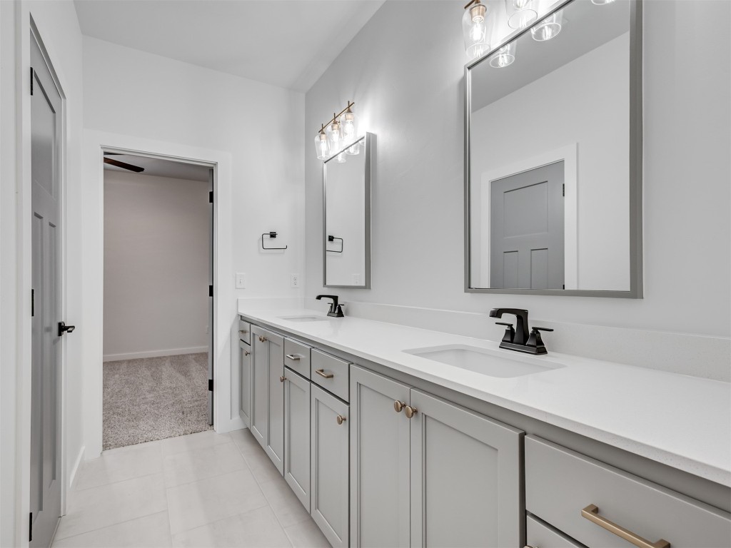 446 Venetian Avenue, Piedmont, OK 73078 bathroom with large vanity, ceiling fan, double sink, and tile flooring