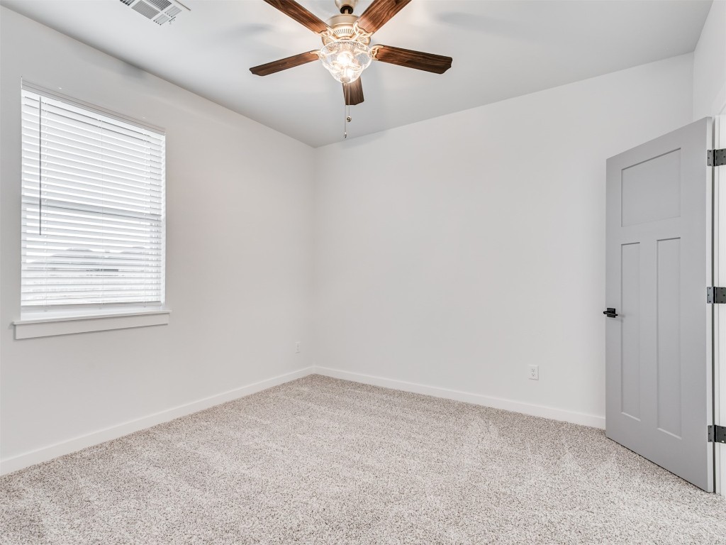 446 Venetian Avenue, Piedmont, OK 73078 empty room featuring plenty of natural light, light colored carpet, and ceiling fan