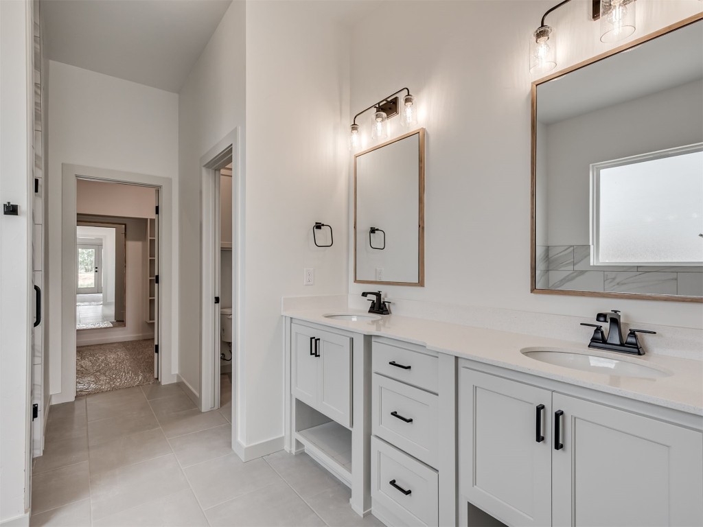 508 Venetian Avenue, Piedmont, OK 73078 bathroom with double vanity, toilet, and tile floors