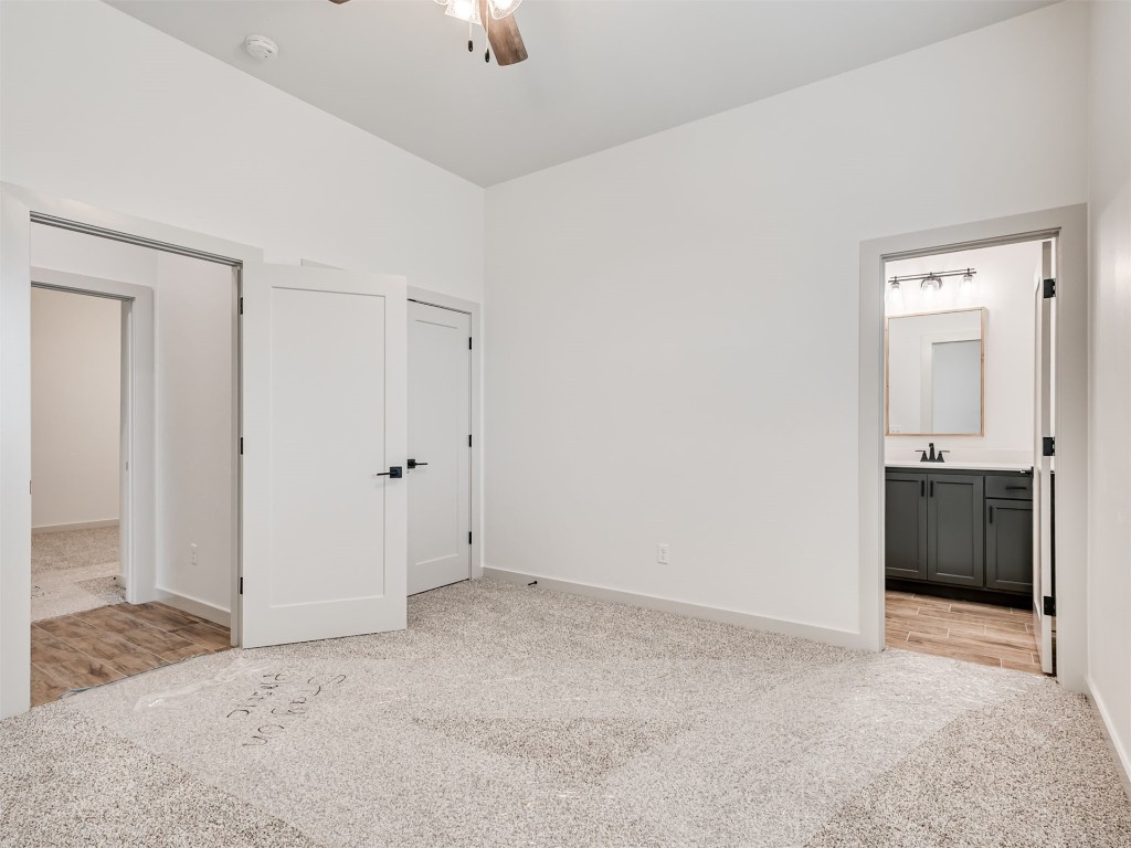 508 Venetian Avenue, Piedmont, OK 73078 walk in closet with light colored carpet