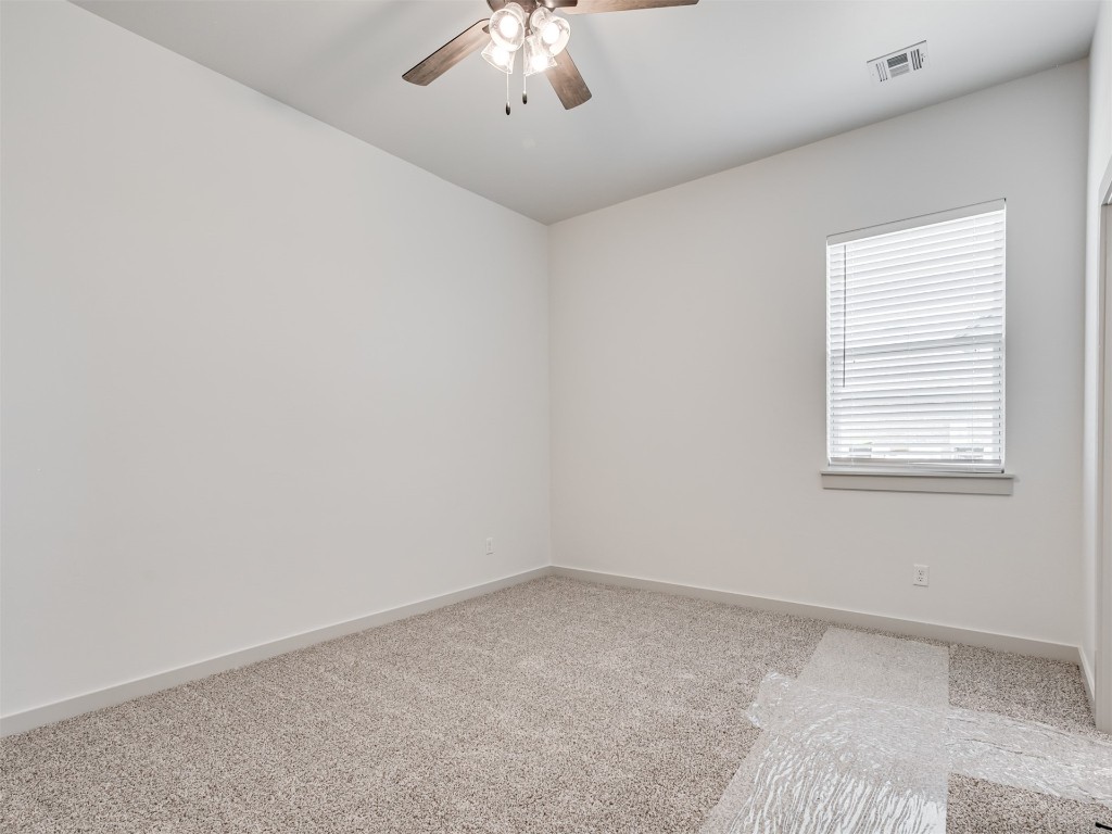 508 Venetian Avenue, Piedmont, OK 73078 empty room with light carpet and ceiling fan