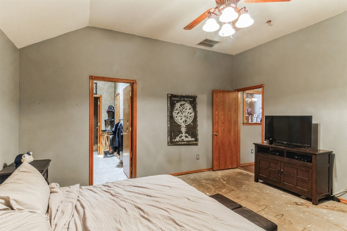 428 E Magnolia Terrace, Mustang, OK 73064 bedroom featuring lofted ceiling and ceiling fan