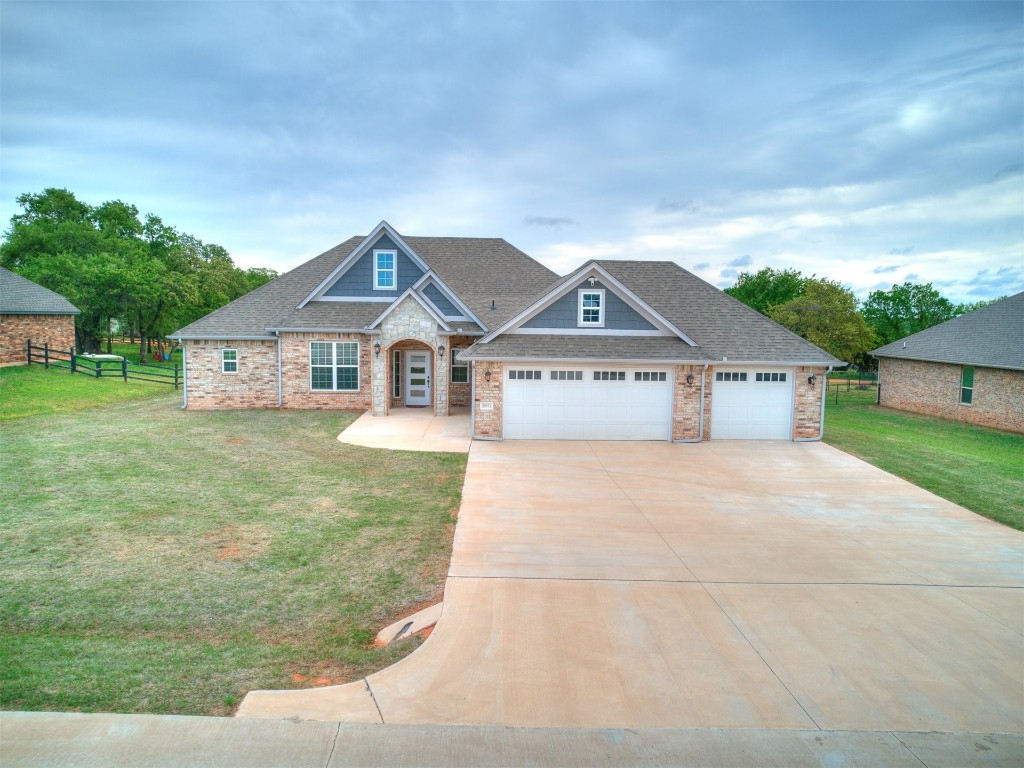 26812 Bridlewood Road, Blanchard, OK 73010 craftsman-style home featuring a garage and a front lawn