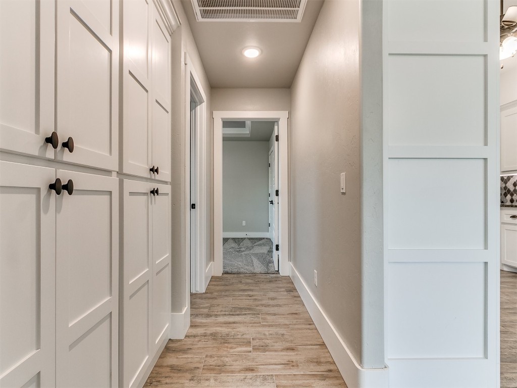 26812 Bridlewood Road, Blanchard, OK 73010 hallway featuring light hardwood / wood-style flooring