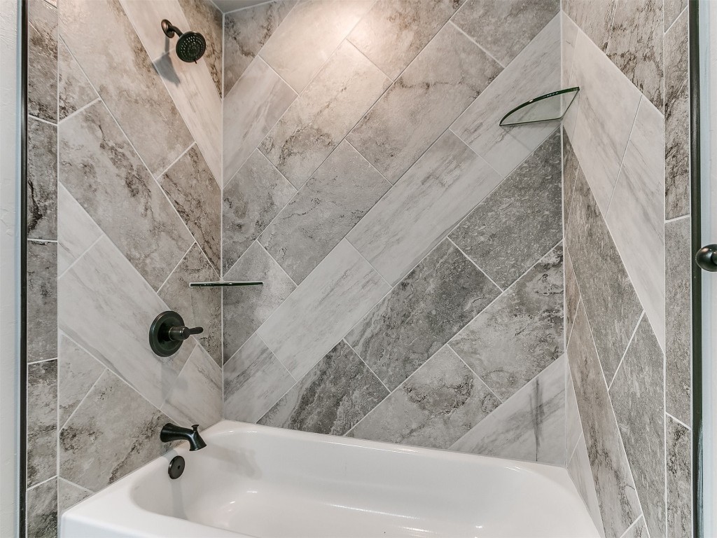 26812 Bridlewood Road, Blanchard, OK 73010 bathroom featuring tiled shower / bath